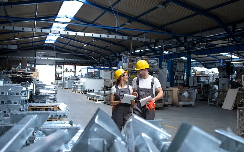 factory-workers-industrial-production-hall-sharing-ideas